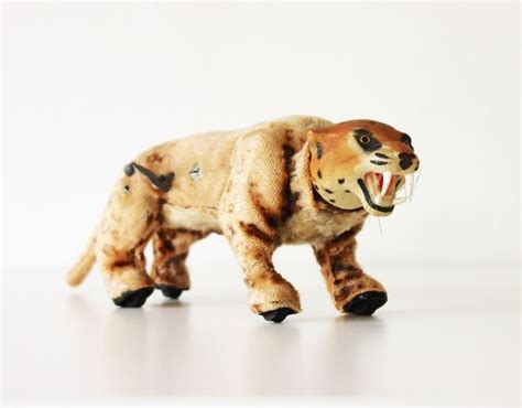 wind up metal leopard toy with fabric wheels in feet|1960’s Marx Wind Up Leopard Moving Roaring Toy .